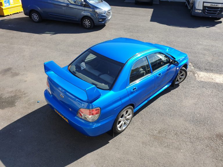 subaru car wrap in blue. vehicle wrapping
